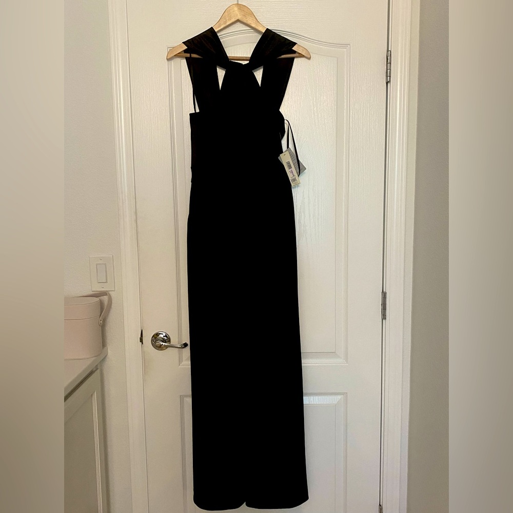 Black Eliza J jumpsuit. Size 6. Sateen (top part) and crepe (legs) New. NWT